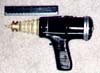 Side view of blaster. Ruler is six inches long